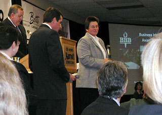 Jane receiving BBB award.