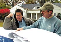 Jane and Dan look over plans.